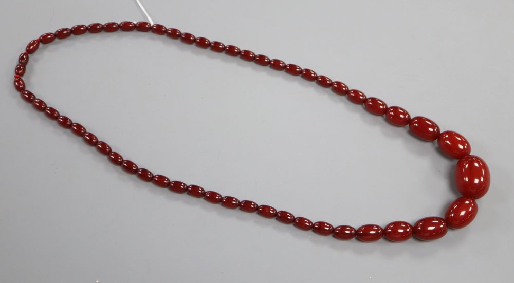 A single strand graduated cherry amber bead necklace, 75cm, gross 66 grams.